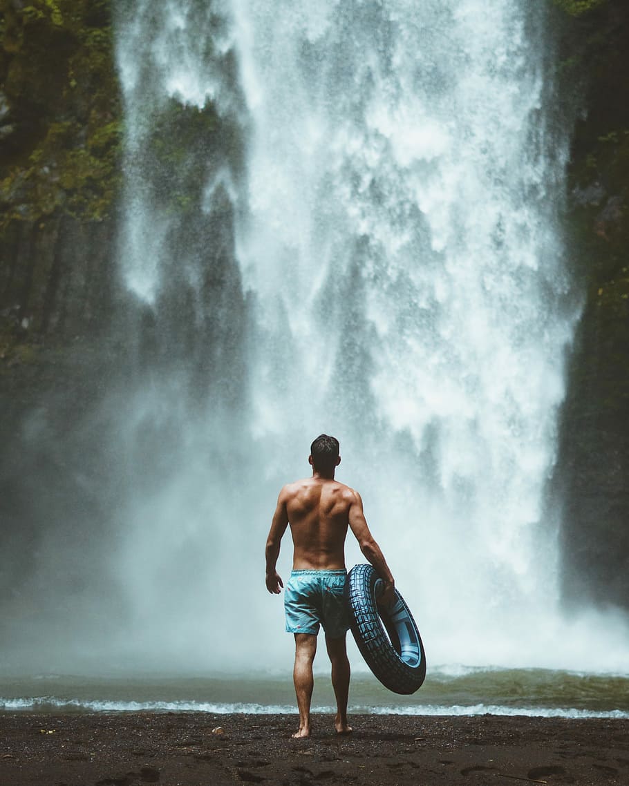 man, holding, swim, ring, walking, towards, waterfalls, water, waterfall, motion