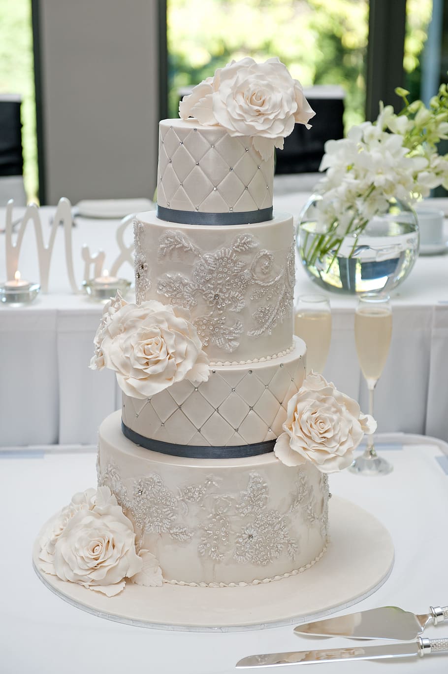white, icing-covered 4- tier cake, 4-tier, tier, wedding cake, table, wedding, cake, food, sweet