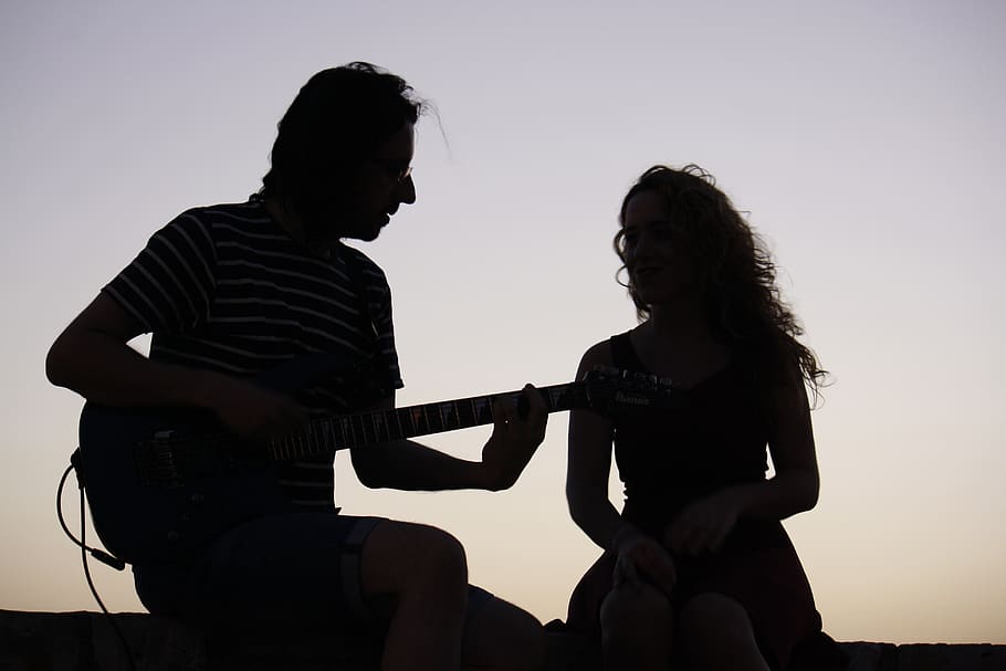 backlight, guitar, music, pairsing, silhouettes, two people, three quarter length, sky, togetherness, playing