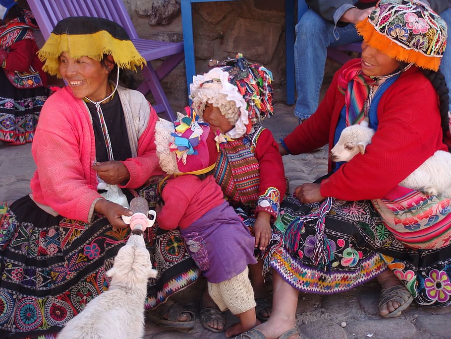 four, people, smiling, white, sitting, gray, concrete, pavement, Ollantaytambo, Peru