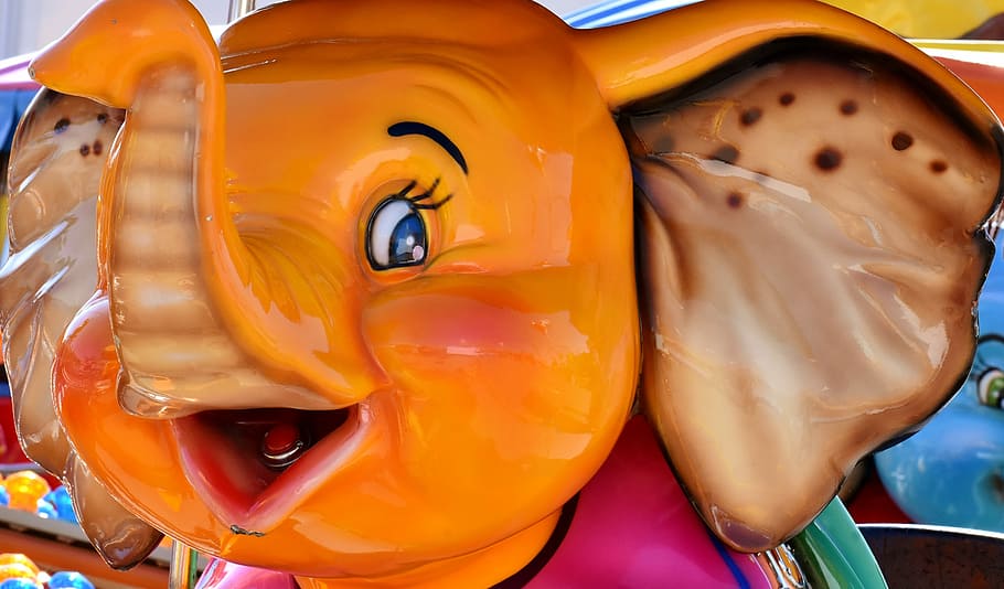 orange, red, ceramic, elephant figurine close-up photo, carousel, ride, elephant, colorful, year market, folk festival