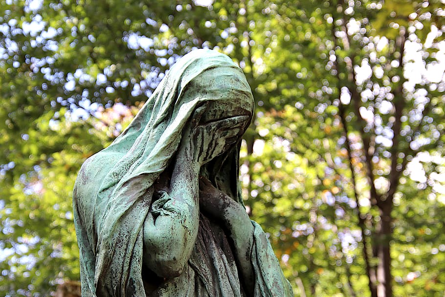 statue, sculpture, bronze, gray-green, patina, woman, grieving, sad, mourning, meditation