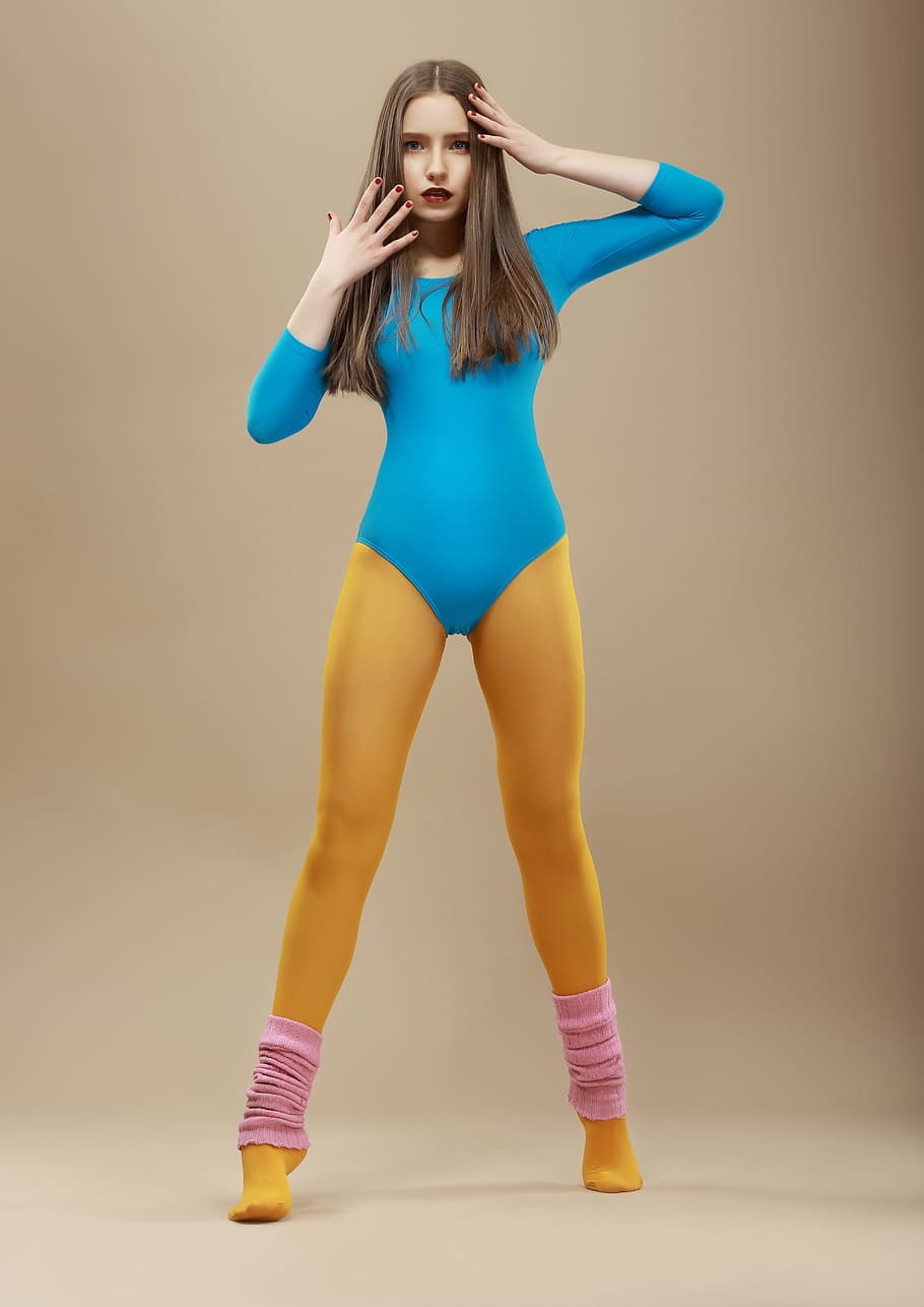 woman, wearing, blue, long-sleeved, bodysuit, yellow, tights, aerobics, exercises, necessary
