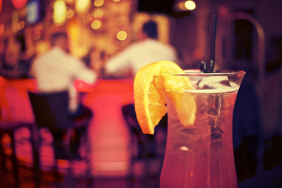 cocktail, drink, alcohol, glass, orange, slice, nightclub, lounge, bar, focus on foreground