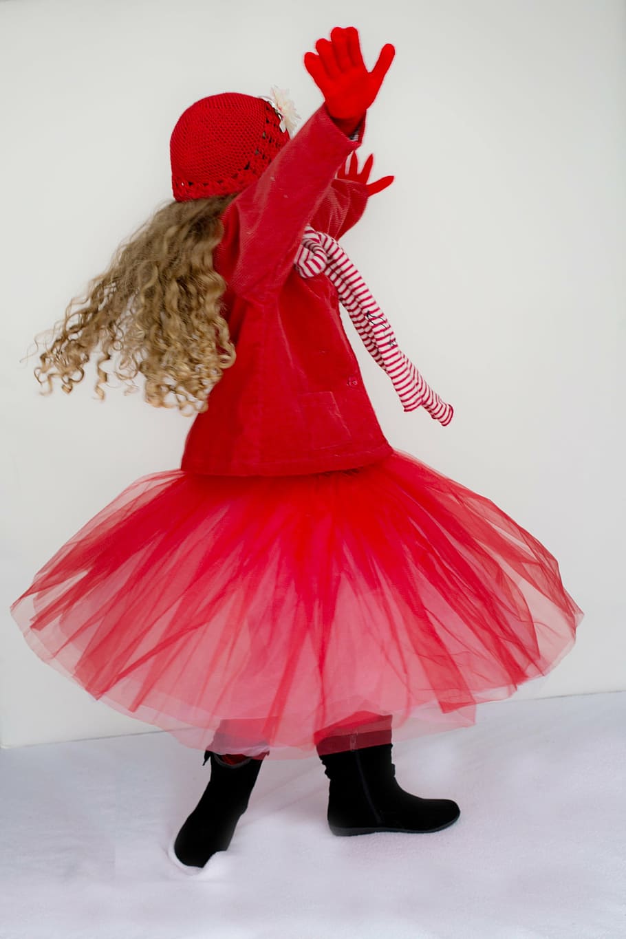 girl, wearing, red, coat, tutu skirt, little girl, dancing, spinning, twirling, happy