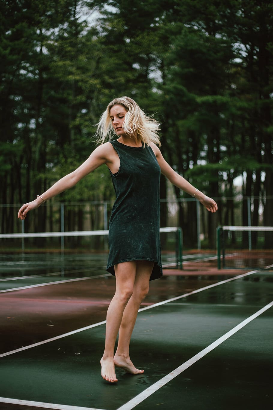 woman, standing, green, maroon, tennis court, people, girl, dancing, court, outside