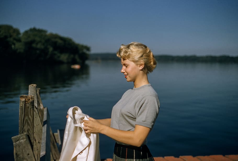 woman, holding, white, cloth, dock, people, lakeside, lake, river, water