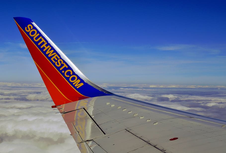 southwest airplane, southwest, airline, transportation, aircraft, flight, commercial, plane, fly, travel