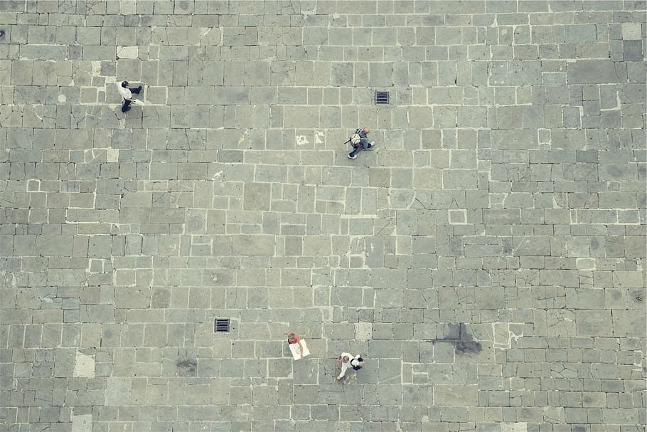 aerial, view, street, people, passing, top, walking, gray, pavement, stones