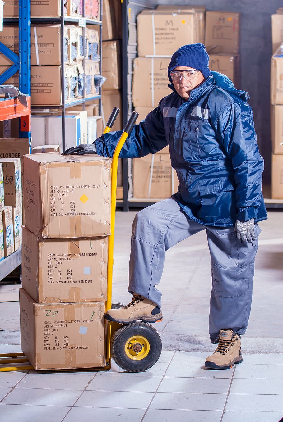 man, wearing, blue, jacket, yellow, hand truck, stevedore, industrial, security, logistic