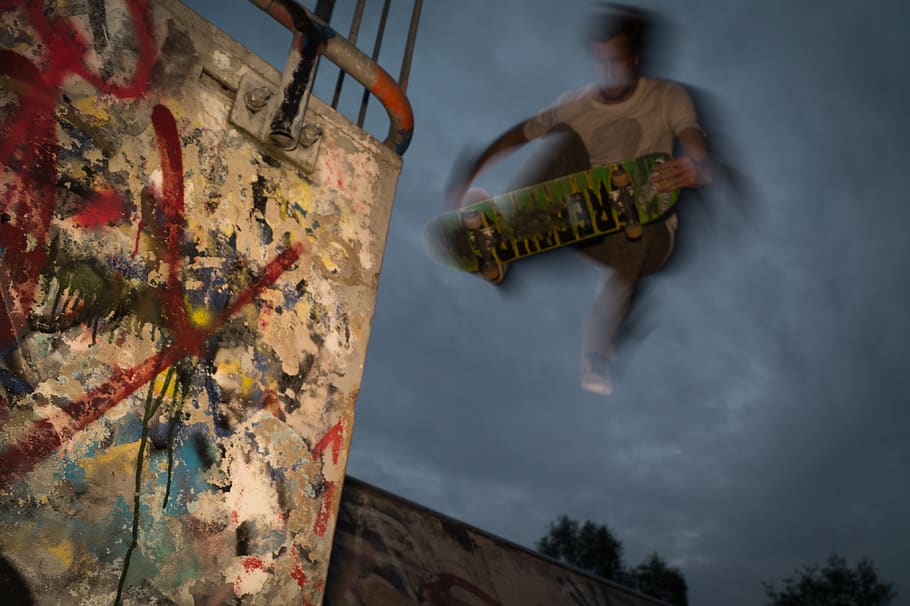 skateboarder, skateboarding, jump, tricks, graffiti, spray paint, one person, cloud - sky, art and craft, sky