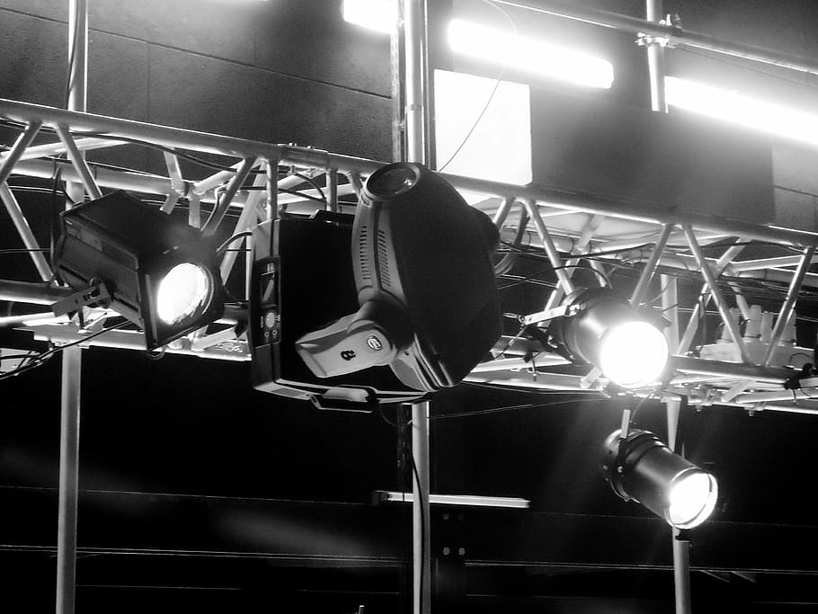 grayscale photography, turned, stage, spotlights, projectors, scene, lights, show, lighting equipment, illuminated