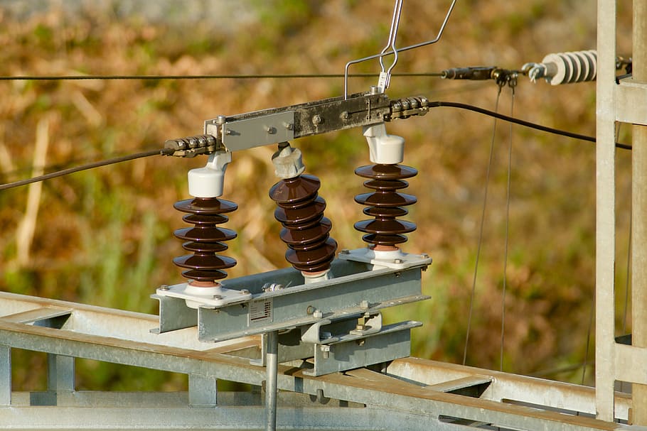technology, railway technology, catenary, insulators, focus on foreground, wood - material, day, metal, close-up, outdoors