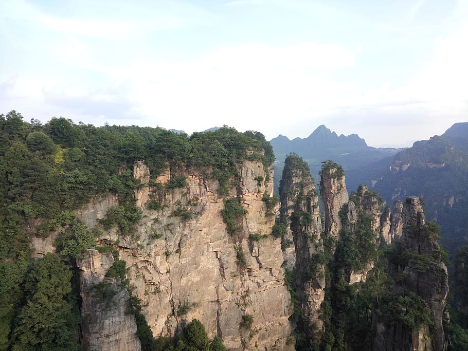 zhangjiajie, mountains, stalagmite, mountain, sky, tree, beauty in nature, scenics - nature, plant, tranquil scene