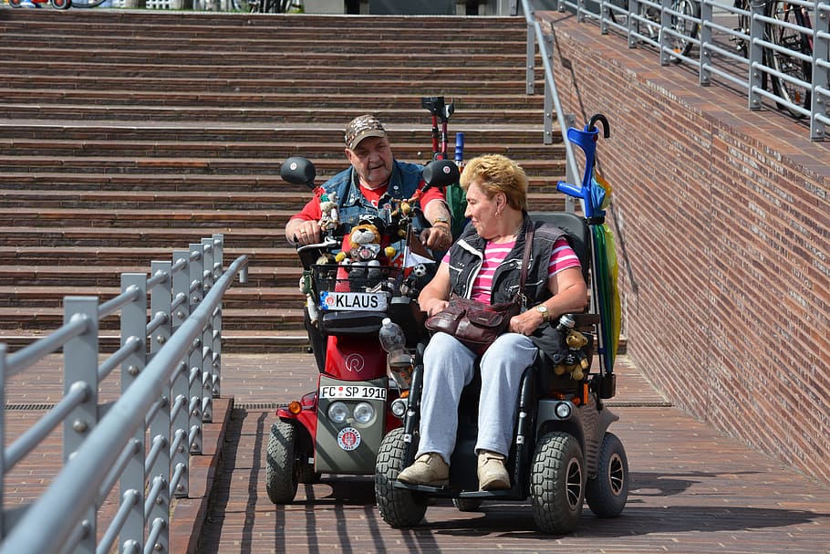 man, woman, riding, power chairs, hamburg, st pauli, wheelchair users, disability, constraint, mobile