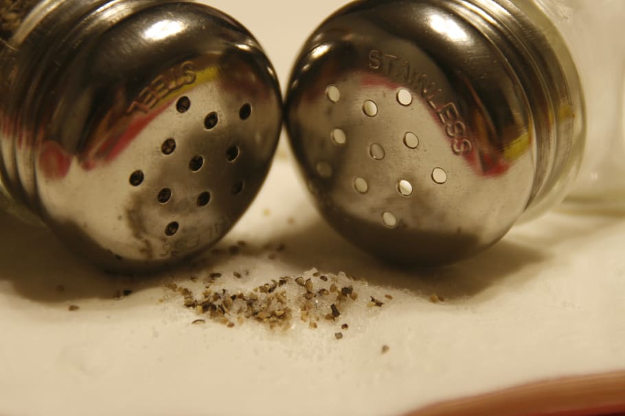 closeup, photography, two, stainless, steel condiment shakers, salt and pepper, shakers, salt, pepper, seasoning
