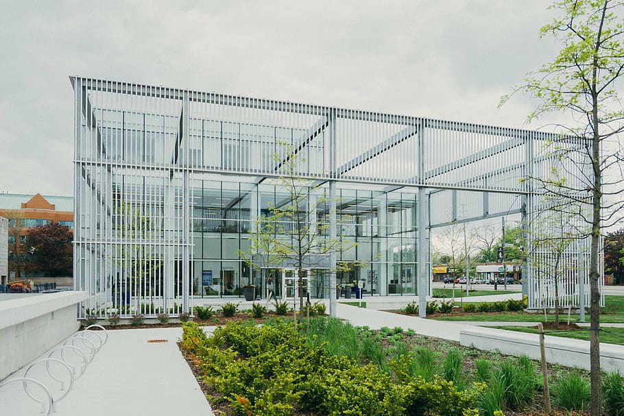 white, glass wall building, surround, plants, trees, architecture, building, infrastructure, blue, sky