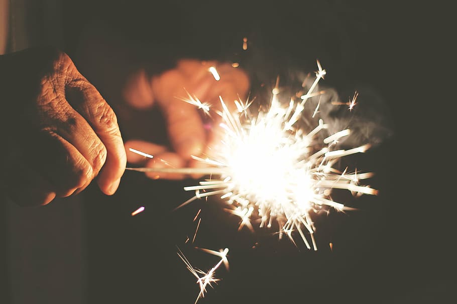 person, holding, lighted, sparkler, man, fire, crackers, hands, wrinkles, sparks