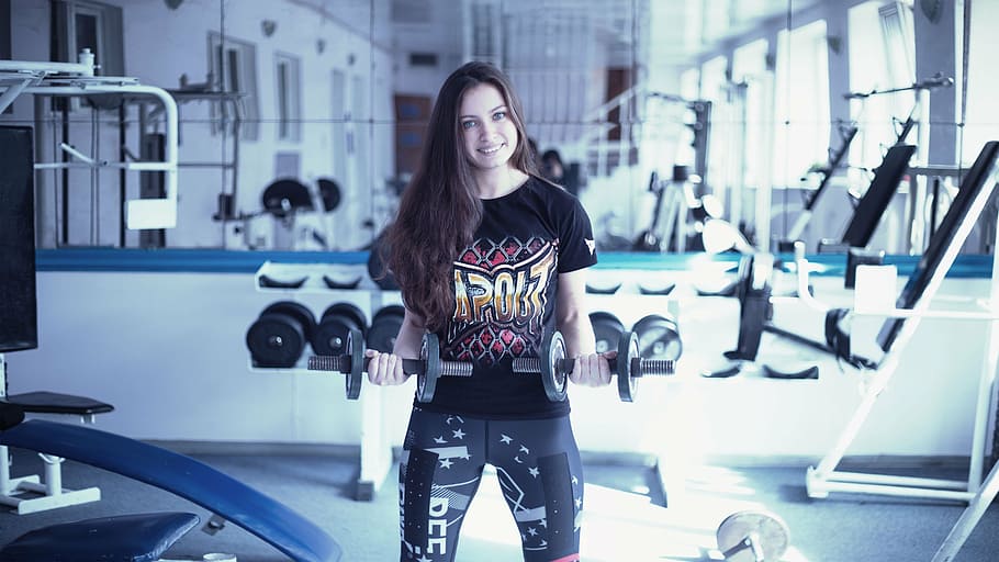 woman, holding, two, black, dumbbells, girl in the gym, training apparatus, kickboxing, boxing, thai boxing