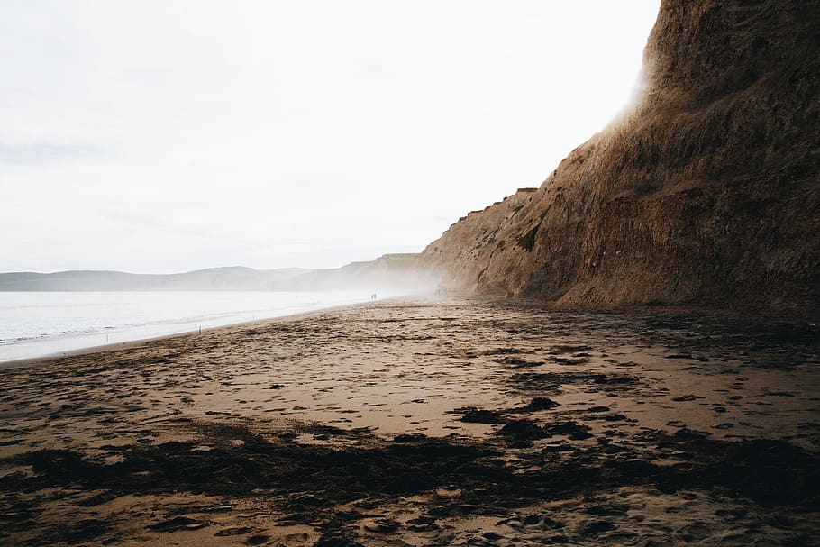 mountain cliff, body, water landscape photo, mountain, cliff, body of water, landscape, beach, brown, fog
