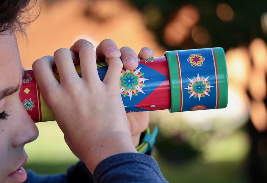 boy, holding, red, blue, scope toy, kaleidoscope, playground, colors, fun, childhood