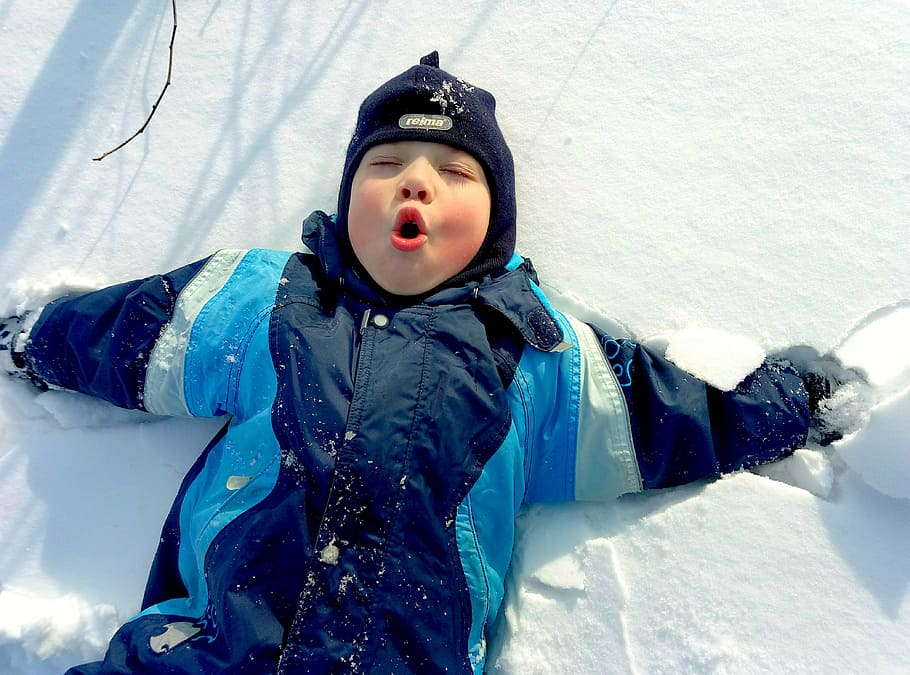 pouting boy, lying, snow ground, daytime, kids, childhood, boy, snow, frost, festivals