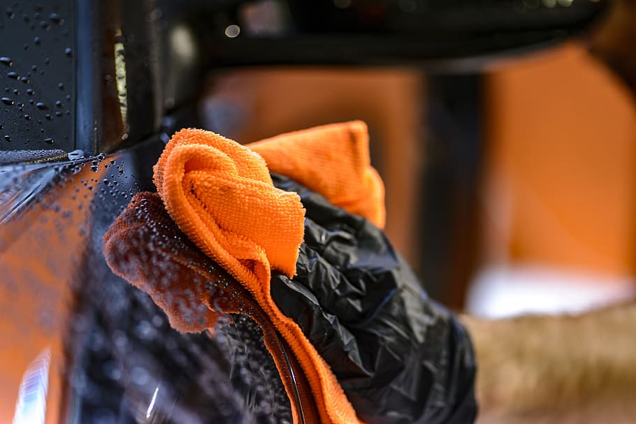 man, wearing, black, gloves, holding, orange, towel, cleaning, steam, smoke