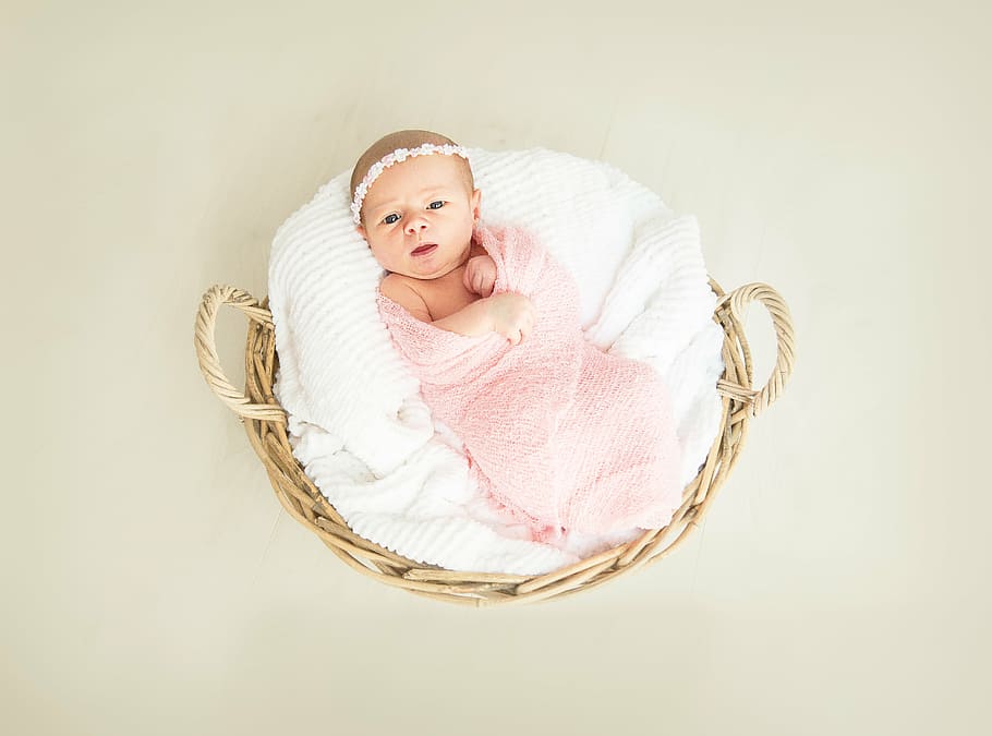 baby, covered, pink, swaddle, round, brown, wicker basket, girl, birth, new born
