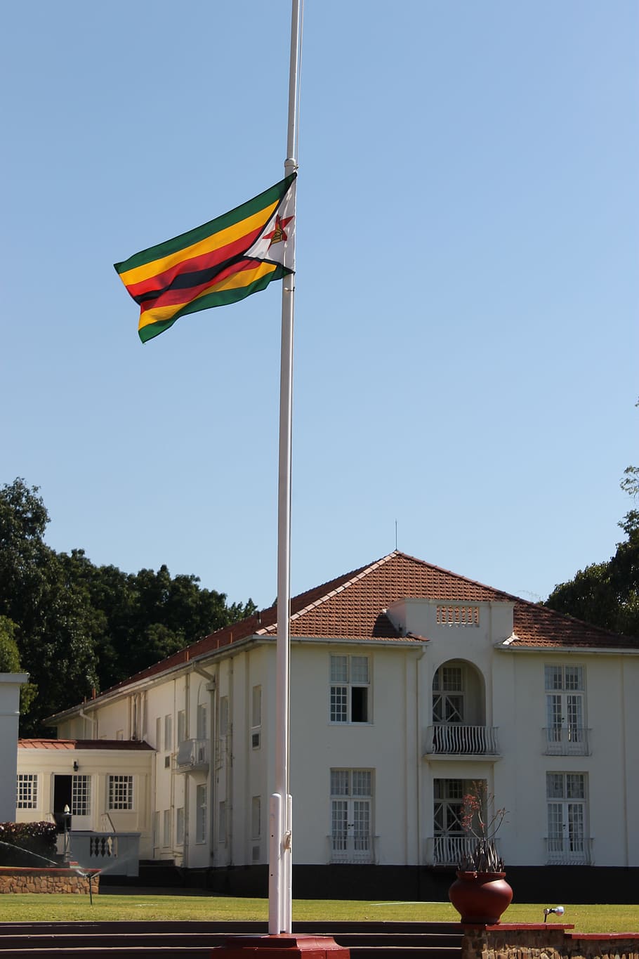 victoria falls hotel, zimbabwe, flag, building exterior, patriotism, built structure, architecture, sky, nature, plant