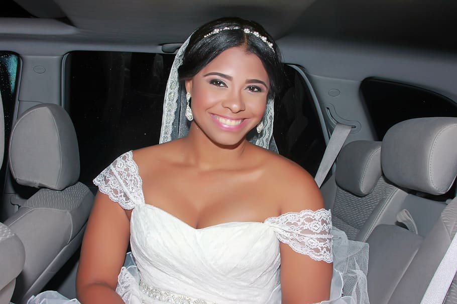 smiling, woman, wearing, white, wedding dress, veil, inside, vehicle, sponge cake, wedding