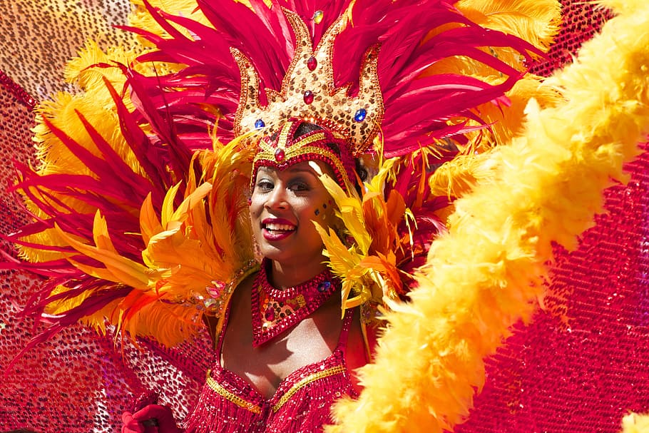woman, wearing, red, yellow, costume, smiling, carnival, orange, cariwest, parade feathers