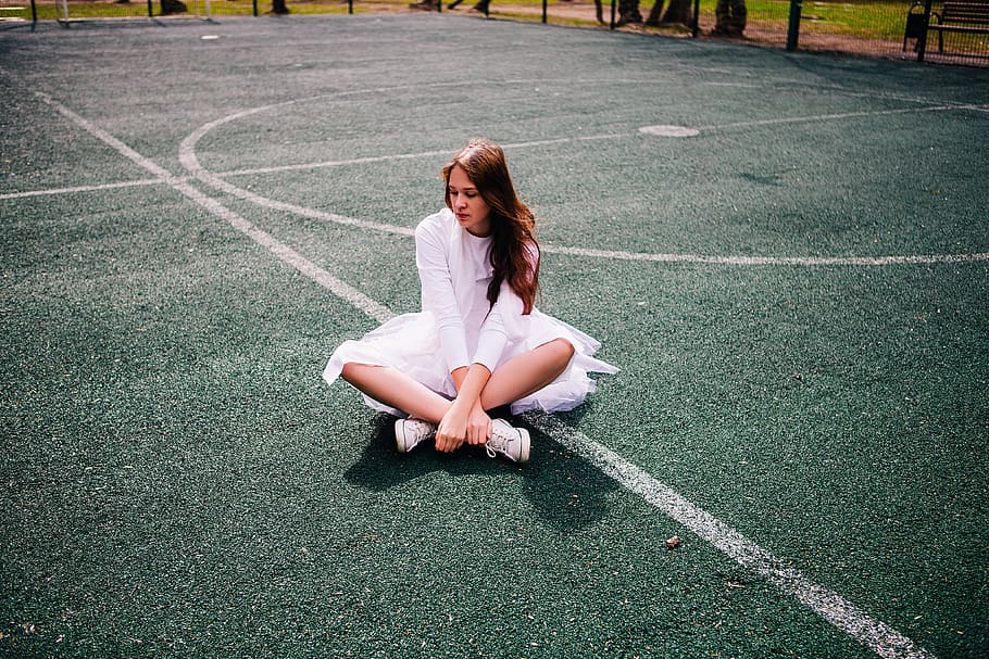 woman, wearing, white, dress, sitting, basketball court, daytime, tennis court, girl, ballet
