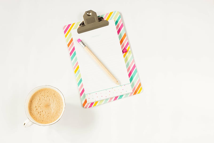 top-view photograph, clipboard, pencil, cup, filled, liquid, coffee, notebook, work desk, work