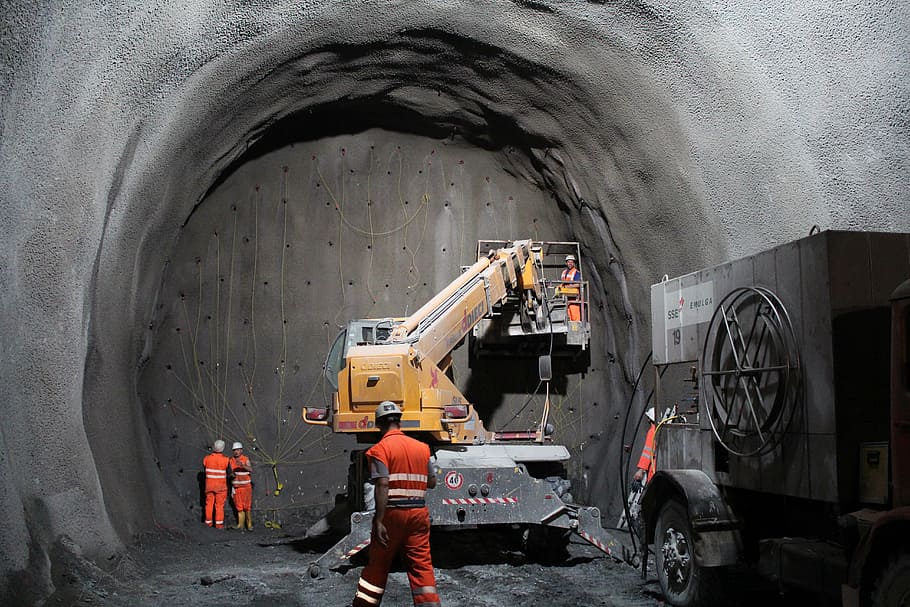 yellow, gray, heavy, equipment, lift, cave, tunnel, blow up, site, construction workers