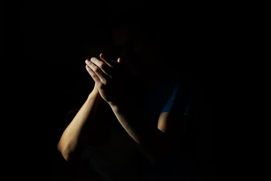 closeup, person arms, black, background, clapping, hands, shadow, poor, light, praying