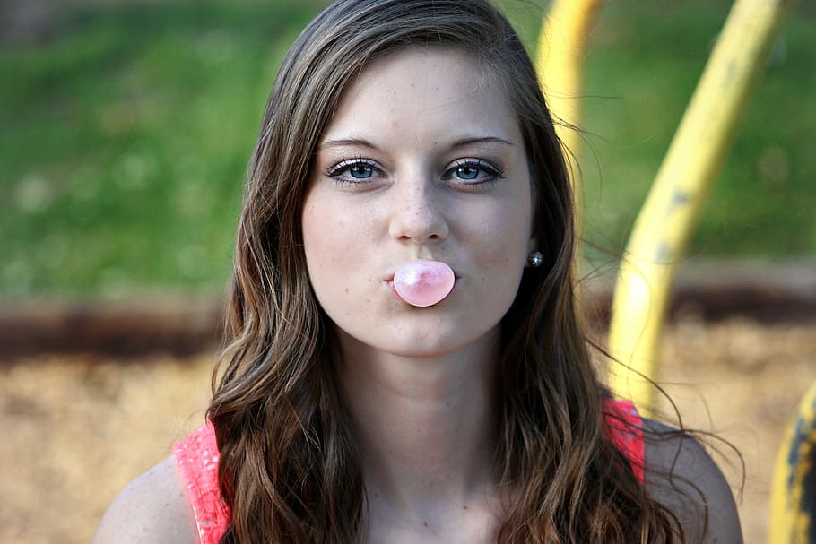 woman blowing bubblegum, girl, bubble, outdoors, young, face, female, portrait, headshot, long hair