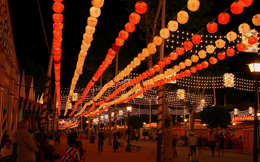 lighted, red, orange, paper lanterns, light garland, garland lights, string lights, seville, april fair, light