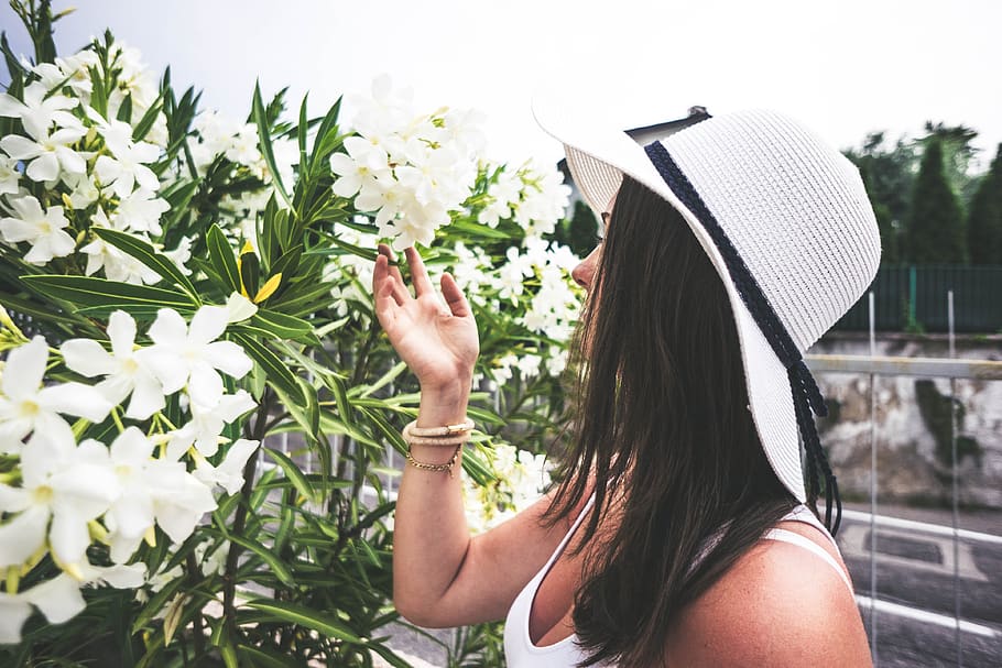 woman, smelling, flowers, nature, hat, summer, summer dress, tanned, travel, vacation