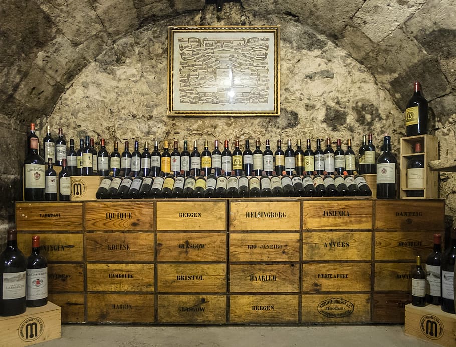 wine bottle lot, brown, wooden, dresser, wine, winery, burgundy, rioja, cava, bottles