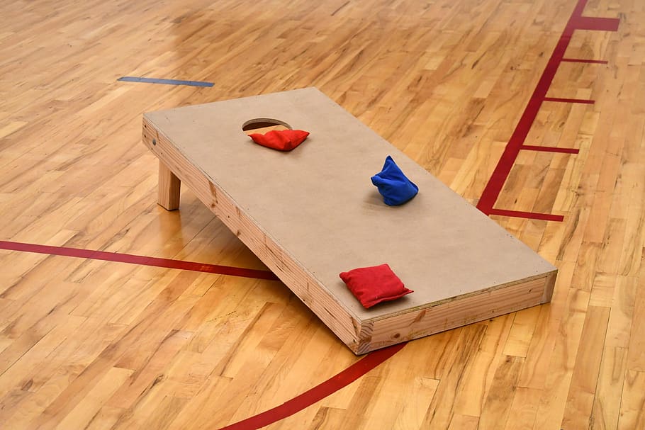cornhole, corn hole, bean bag toss, game, lawn game, gym, wood - material, indoors, high angle view, flooring
