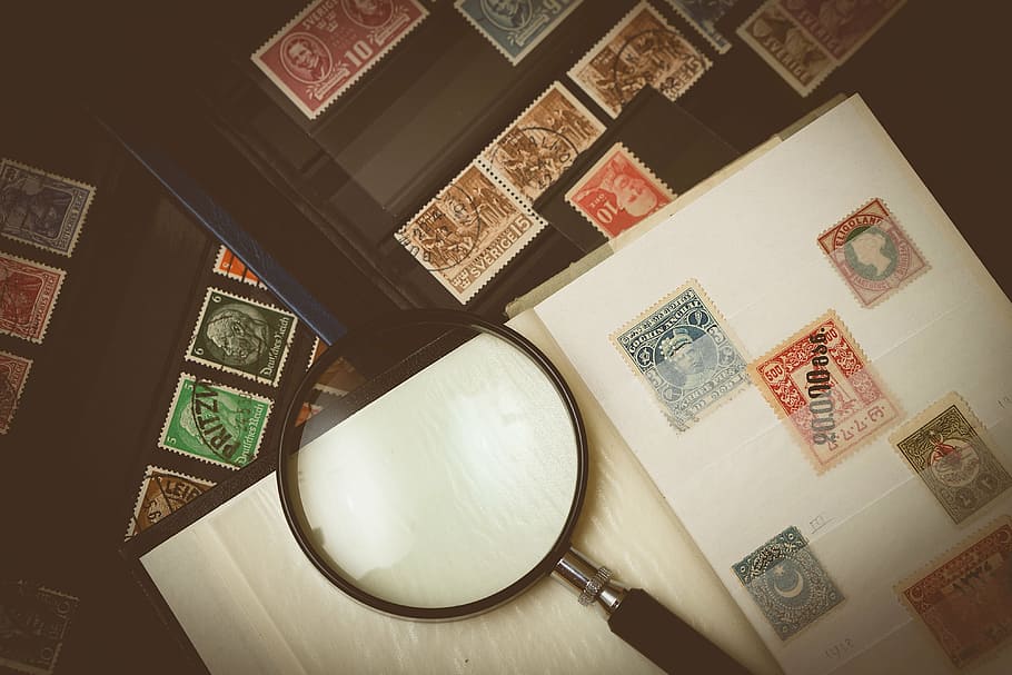 assorted-color postage stamp collection, magnifying, glass, table, philatelist, stamp collection, stamp, collecting, collection, loop