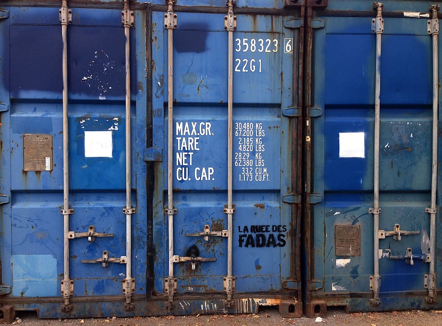 blue intermodal container, container, blue, container door, metal, text, industry, communication, architecture, western script
