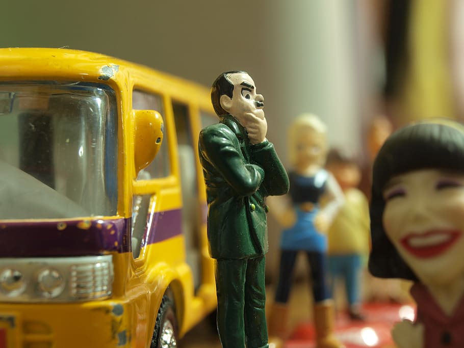 shallow, focus photography, man, green, suit coat plastic toy, bus stop, bus, waiting, john cleese, worry