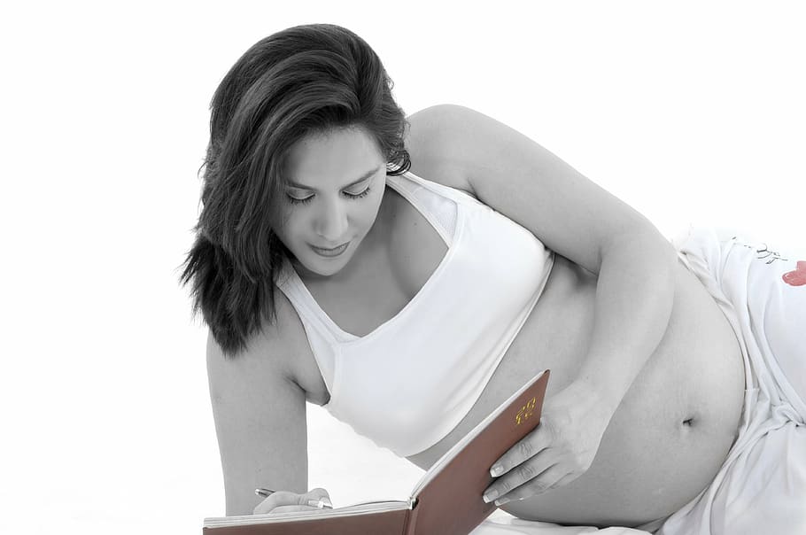 grayscale photo, woman, holding, book, pen, pregnant, mama, women, maternal, human Abdomen