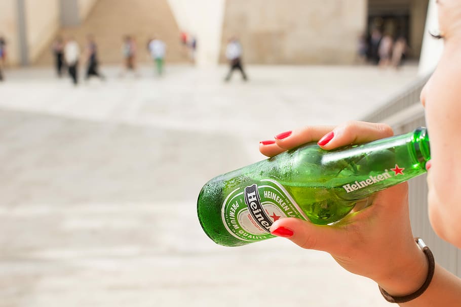 heineken beer bottle, Heineken beer, beer bottle, beer, drink, drinking, hands, Heineken, outside, people