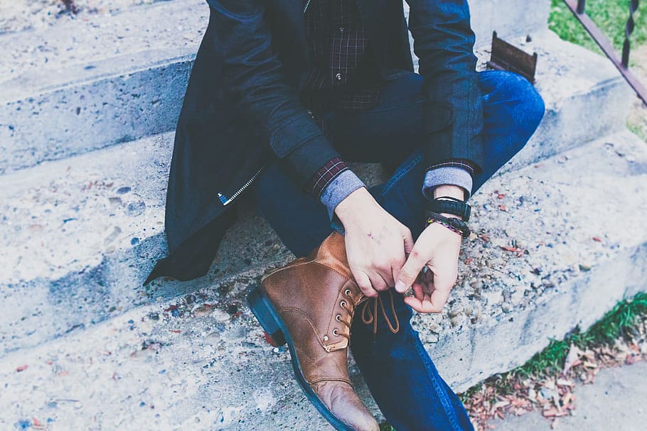 person, wearing, blue, jeans, brown, boots, guy, man, male, sit