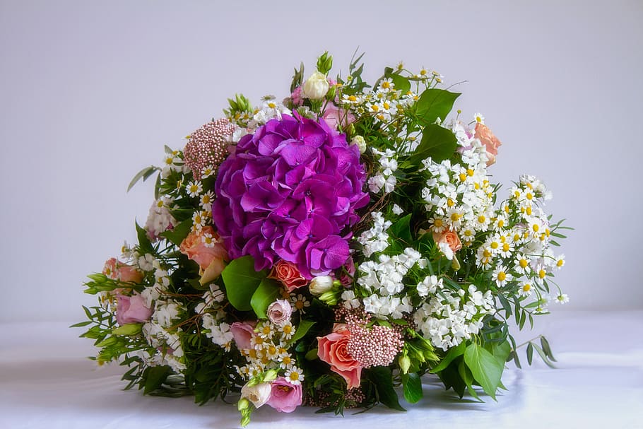 assorted-color petaled flower centerpiece, white, surface, flower, bouquet, colorful, give, spring flowers, joy, spring bouquet