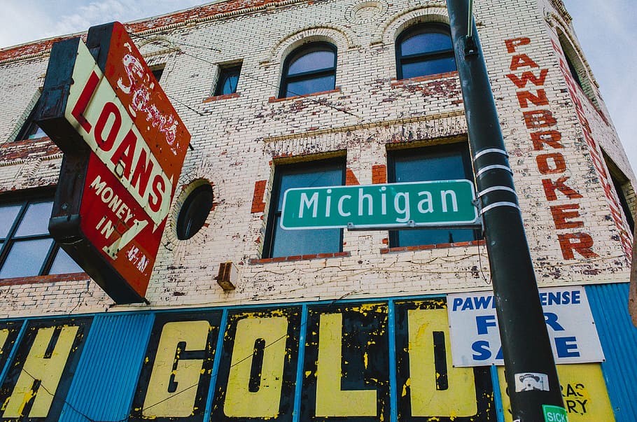 ONLY IN AMERICA, Michigan street signage, communication, text, western script, architecture, sign, built structure, building exterior, low angle view
