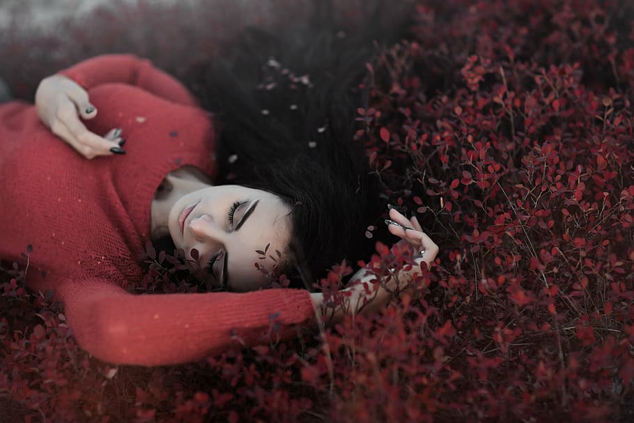 woman, wearing, red, sweater, lying, leaf plants, long, sleeve, shirt, flower