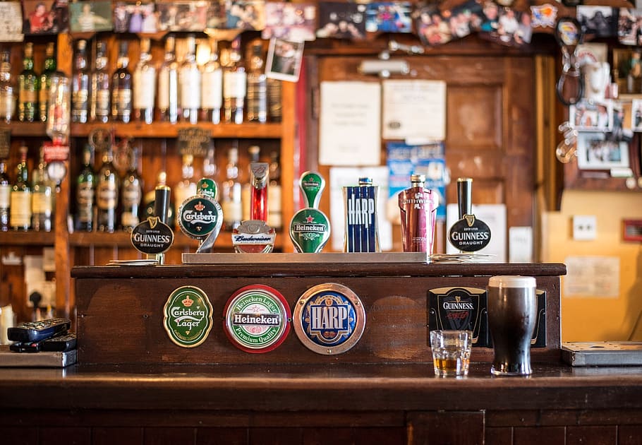 assorted beer taps, bar, local, cong, ireland, irish pub, pub, bottles, whisky, tap